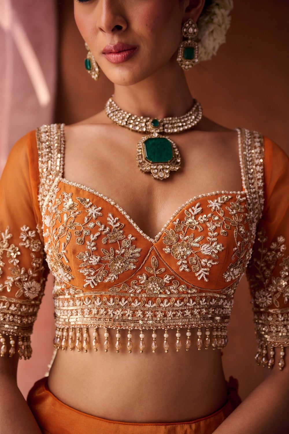 Rust orange embroidered blouse, shimmer tissue lehenga and dupatta