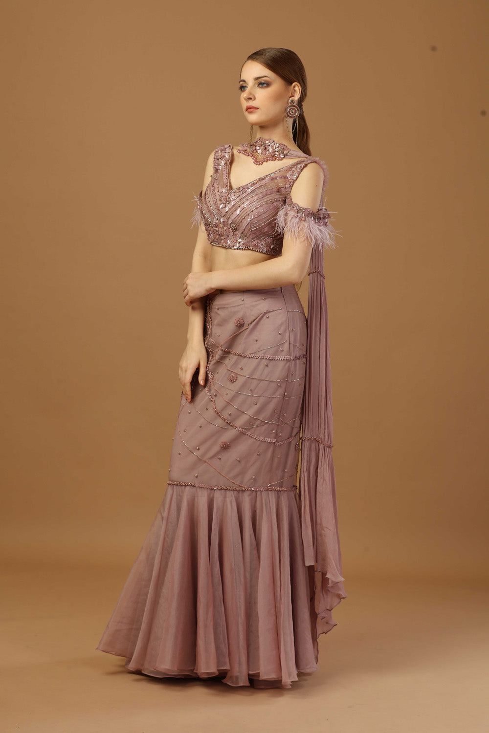 Fish Cut Skirt With Matching Tonal Blouse And A Narrow Neck Dupatta.