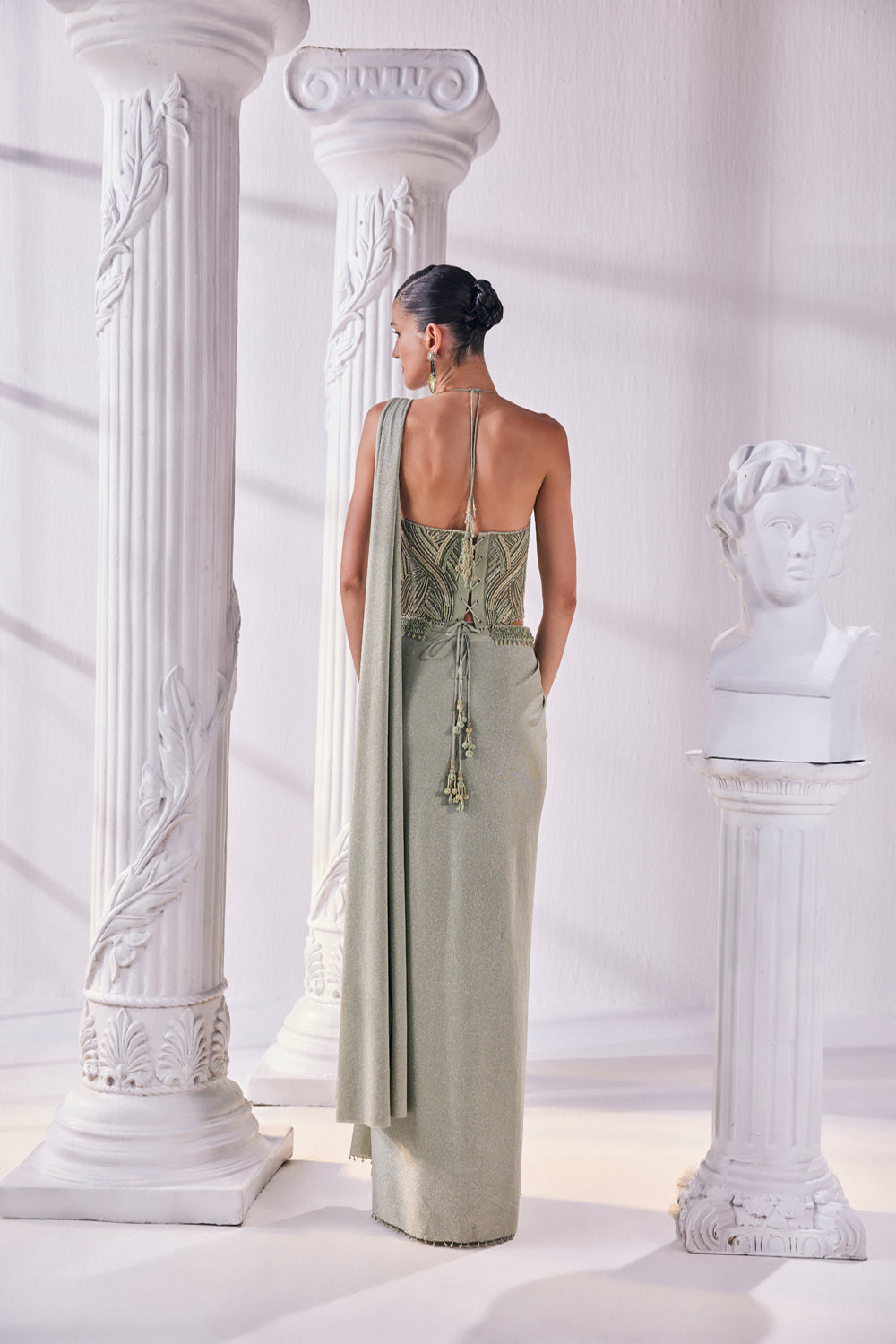 Jade Green Draped Saree In Luxurious Shimmer Lycra Paired With Anemroidered Corset And A Belt.