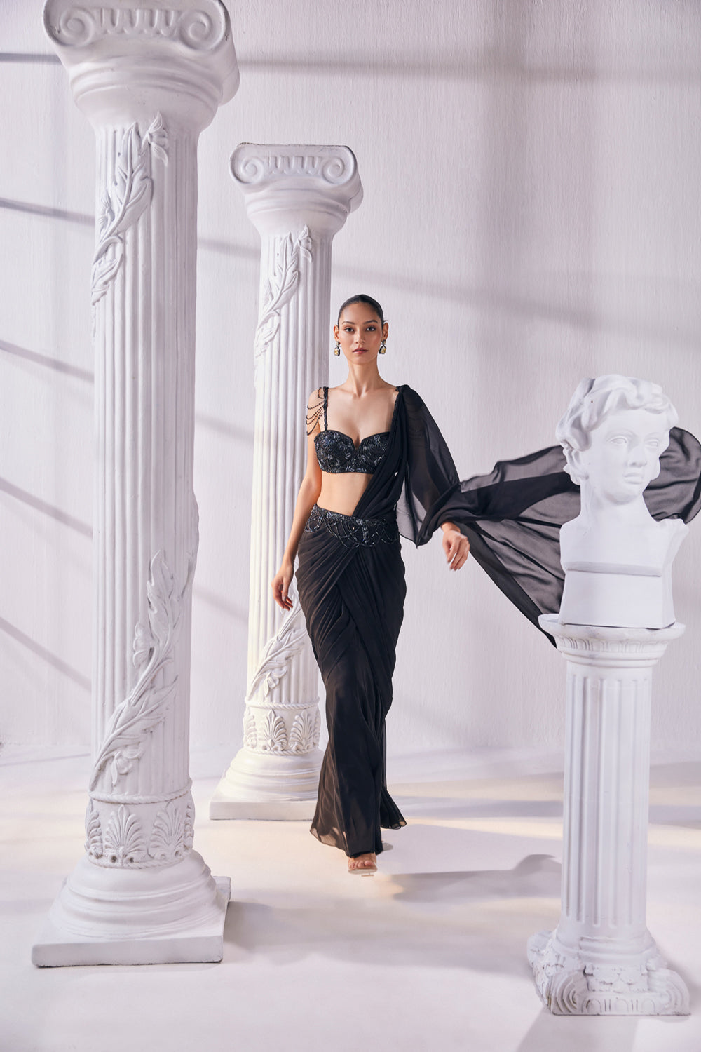 Draped Saree In Royal Georgette Fabric Designed With An Embroidered Bustier And A Statement Belt.