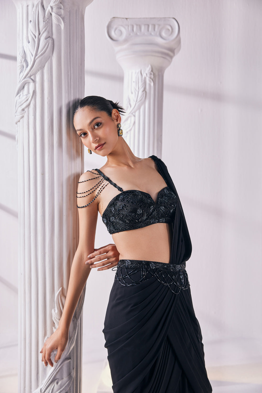 Draped Saree In Royal Georgette Fabric Designed With An Embroidered Bustier And A Statement Belt.