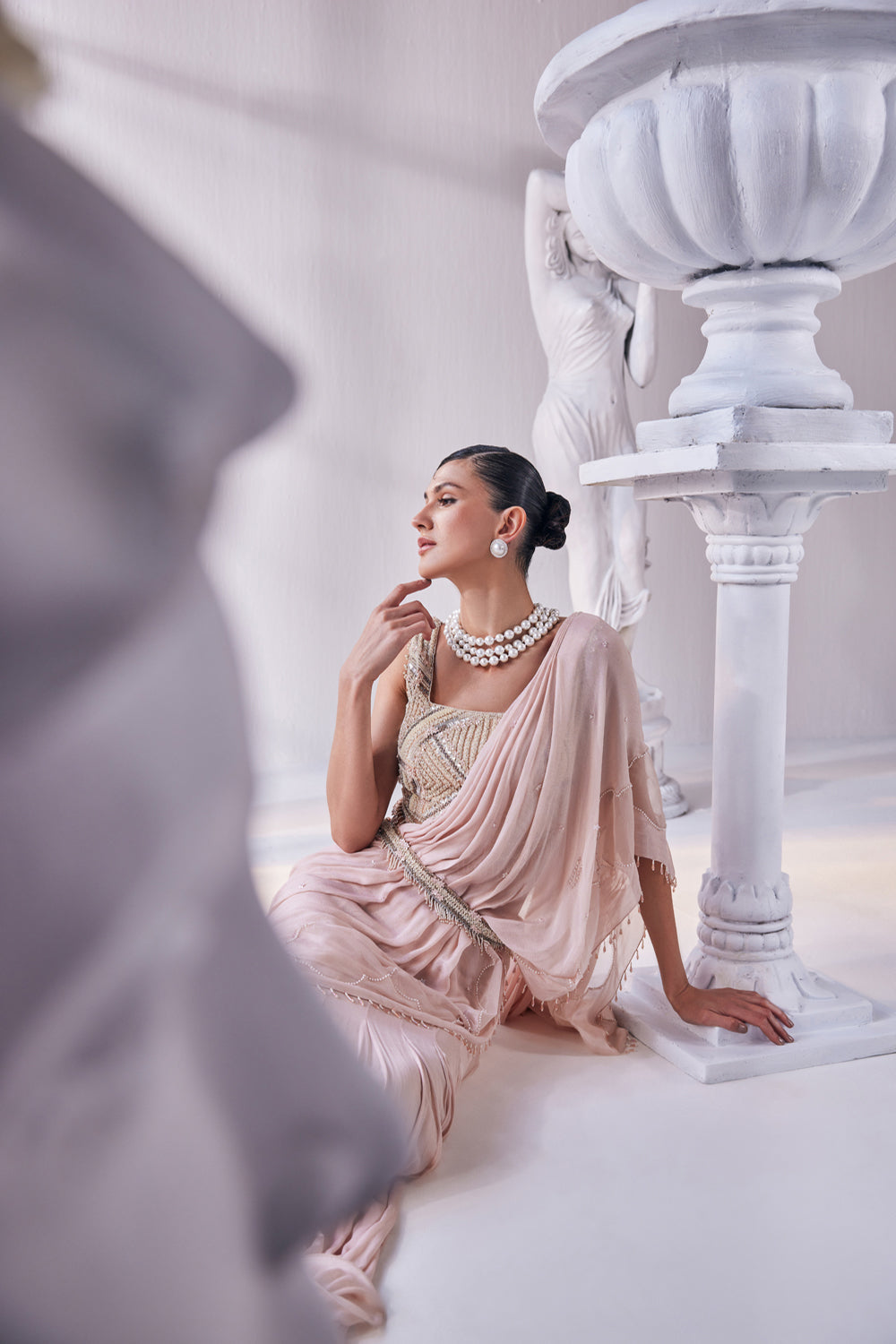 Peach Chiffon Drape Saree With Bead Work Detail Paired With A Heavy Emroidered Blouse And A Belt.