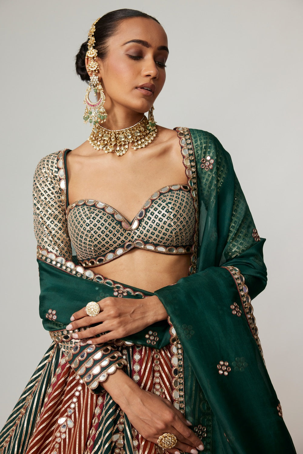 CRANBERRY FLOWER LINEAR LEEHNGA WITH FULL SLEEVE BLOUSE.