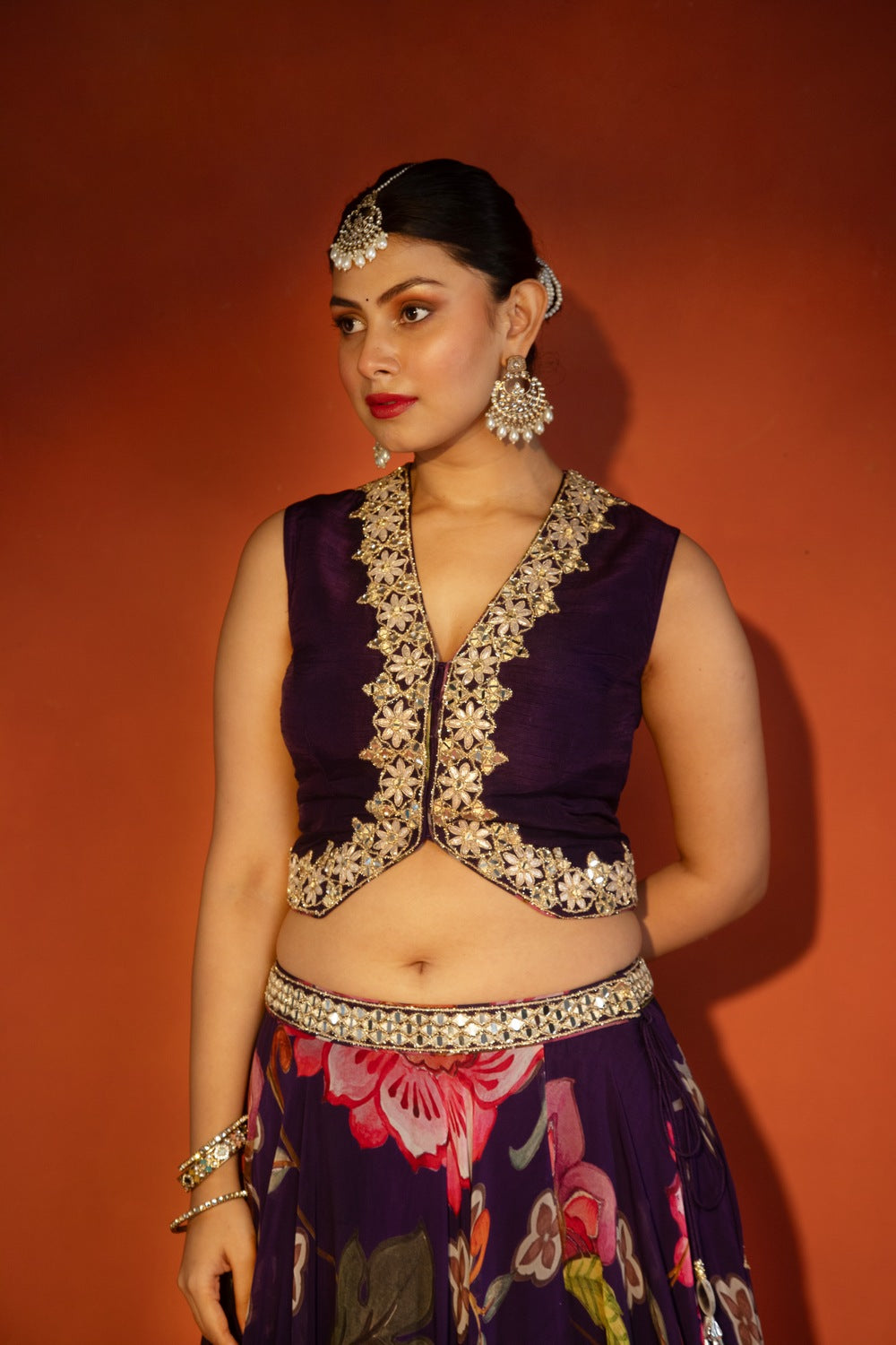 Purple floral lehenga with mirror-work waistcoat and placement dupatta