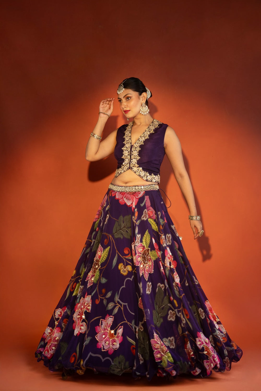 Purple floral lehenga with mirror-work waistcoat and placement dupatta