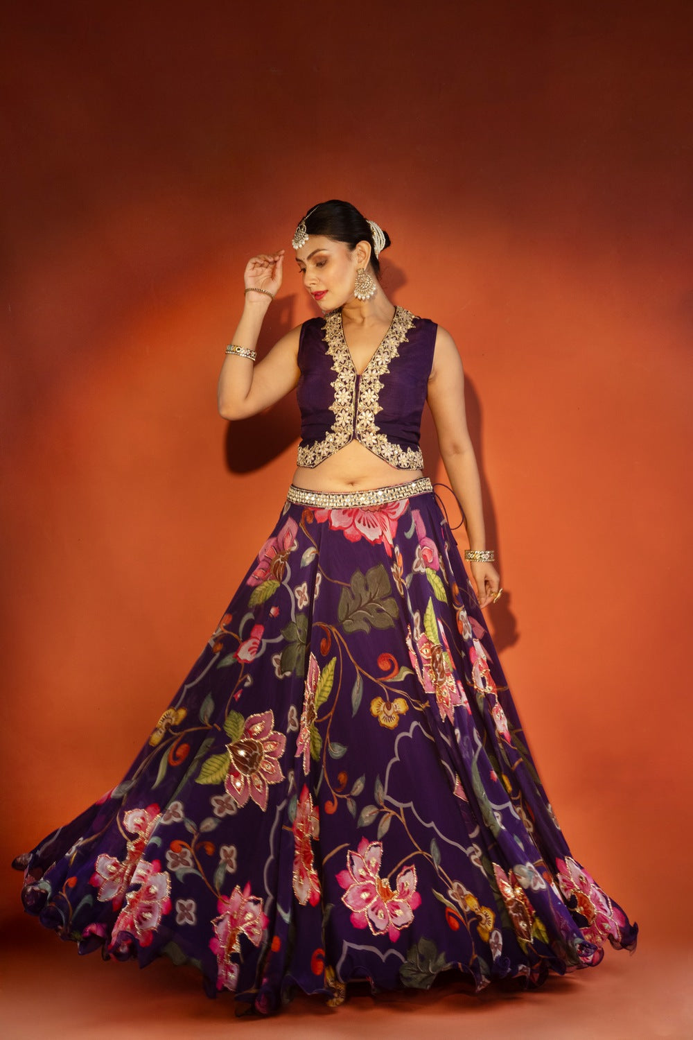 Purple floral lehenga with mirror-work waistcoat and placement dupatta