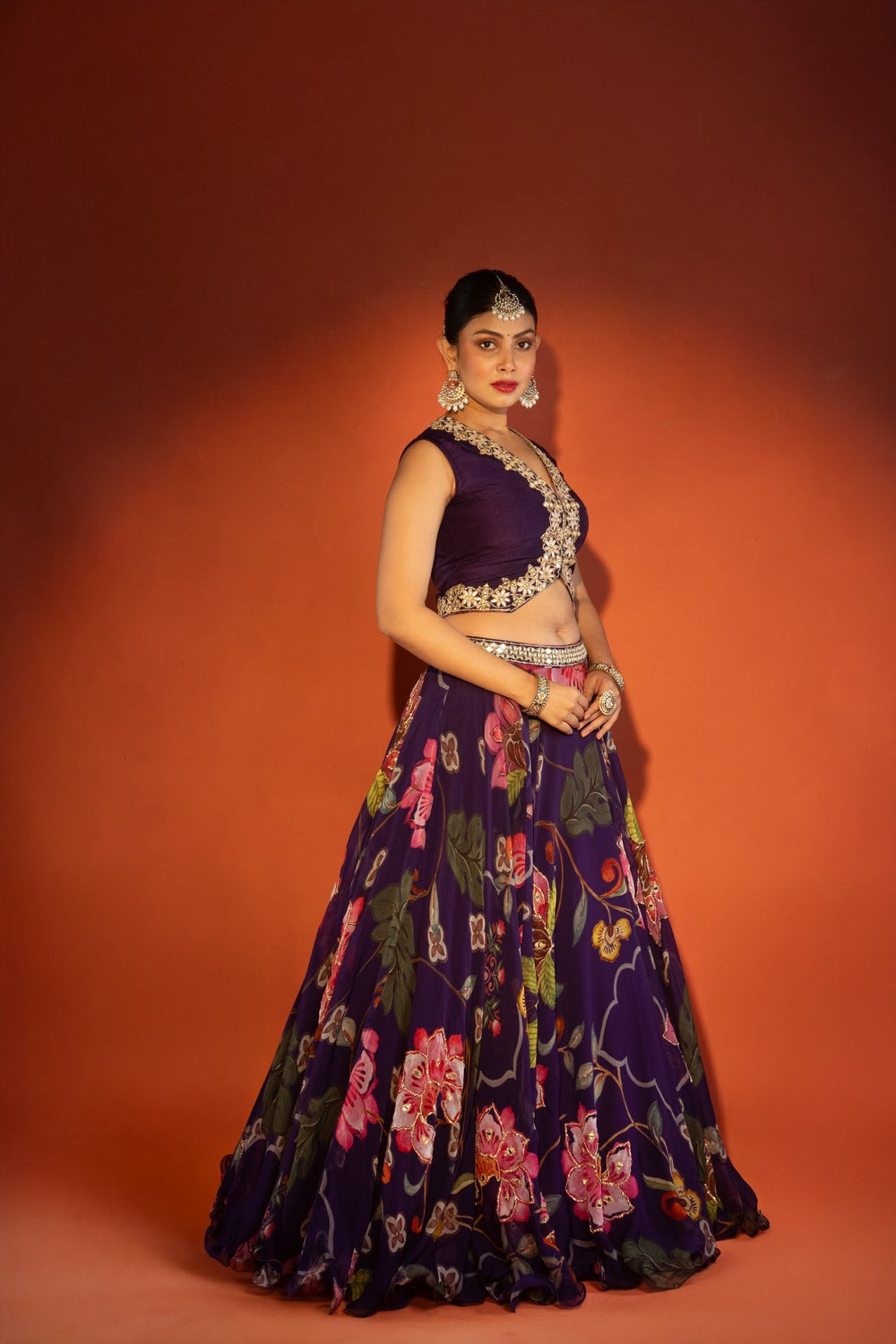 Purple floral lehenga with mirror-work waistcoat and placement dupatta