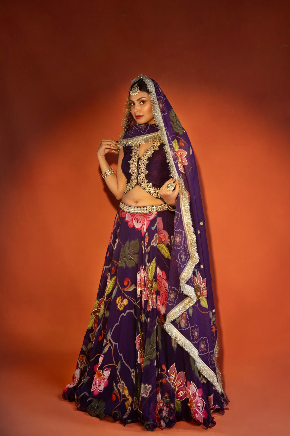 Purple floral lehenga with mirror-work waistcoat and placement dupatta