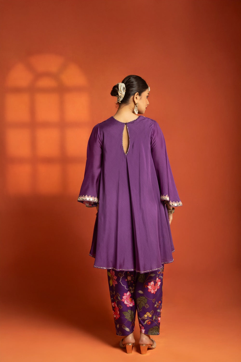 Purple Short Semi- Anarkali with a heavily Embroidered Neckline, Paired with Floral Printed Salwar Pants & Dupatta