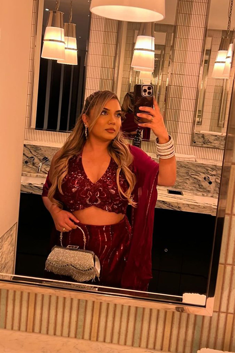 Kajal in Burgundy Halter Top And Skirt Set