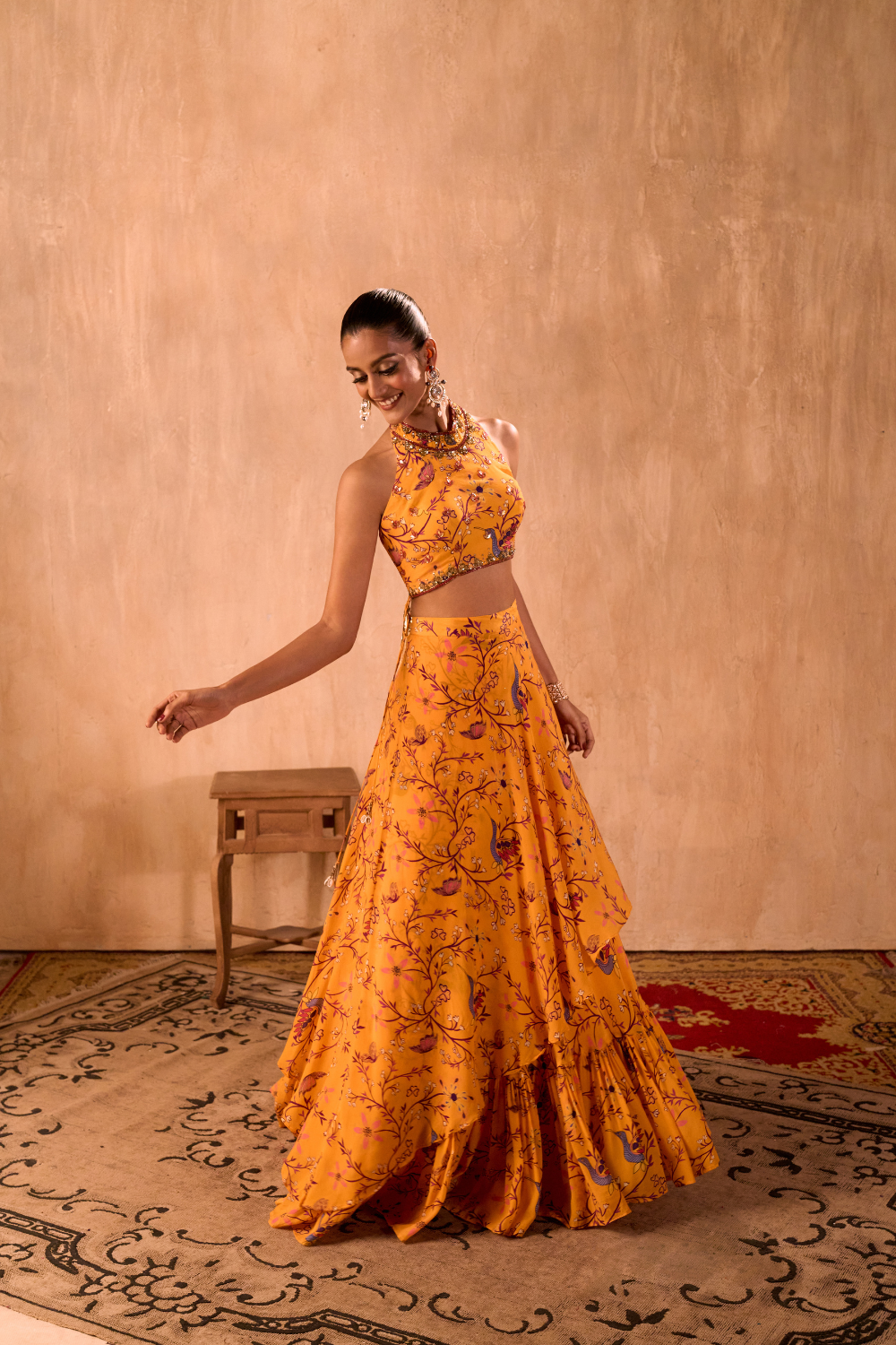YELLOW PRINT EMBROIDERED HALTER CHOLI AND LAYERED LEHENGA SKIRT SET