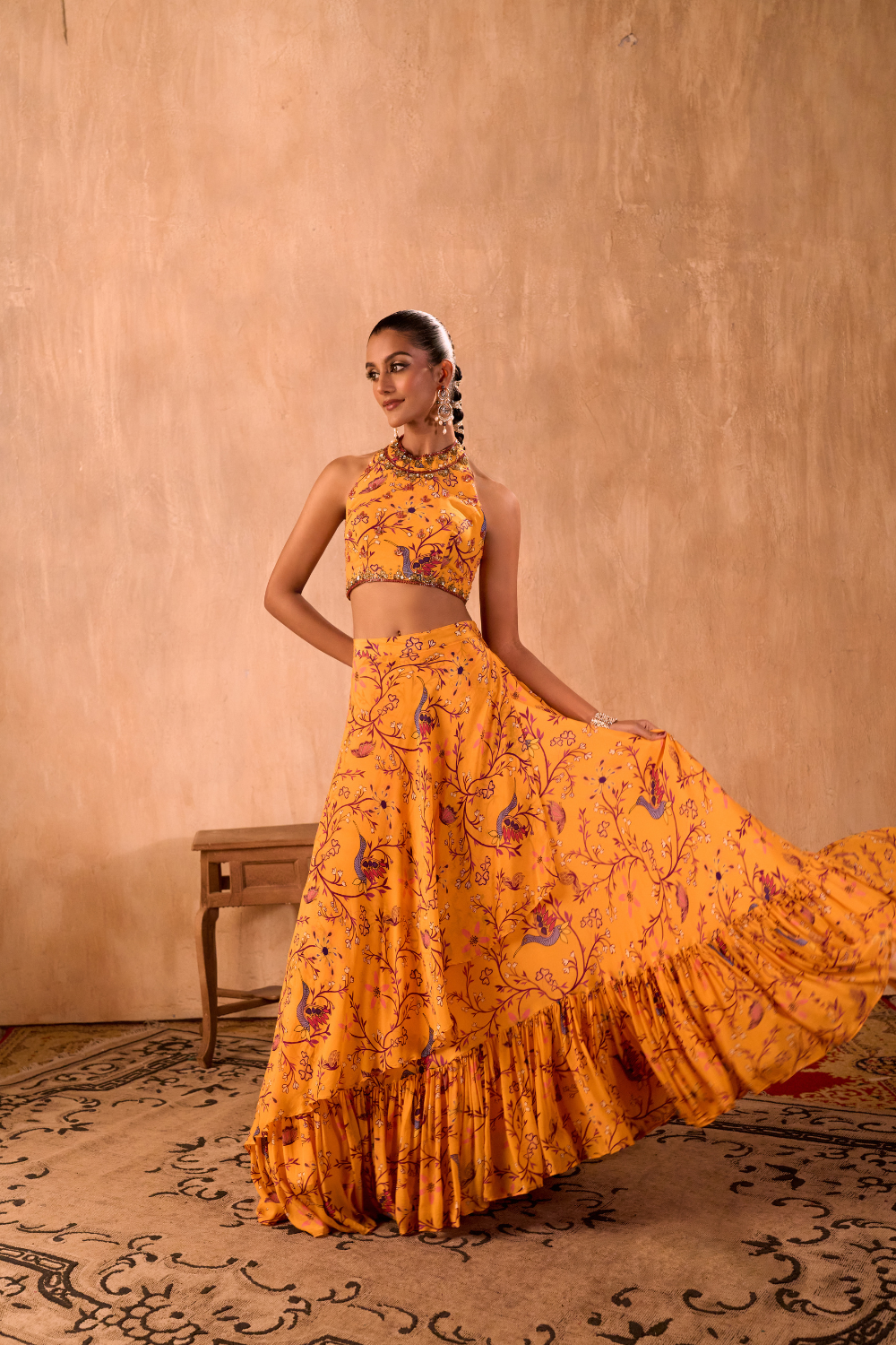 YELLOW PRINT EMBROIDERED HALTER CHOLI AND LAYERED LEHENGA SKIRT SET