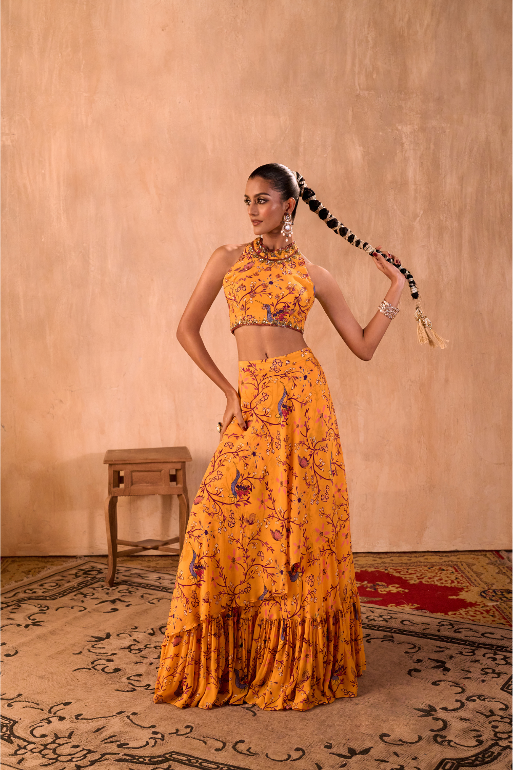 YELLOW PRINT EMBROIDERED HALTER CHOLI AND LAYERED LEHENGA SKIRT SET