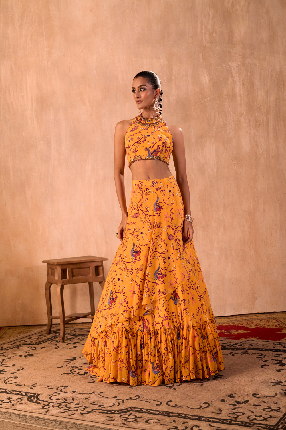 YELLOW PRINT EMBROIDERED HALTER CHOLI AND LAYERED LEHENGA SKIRT SET