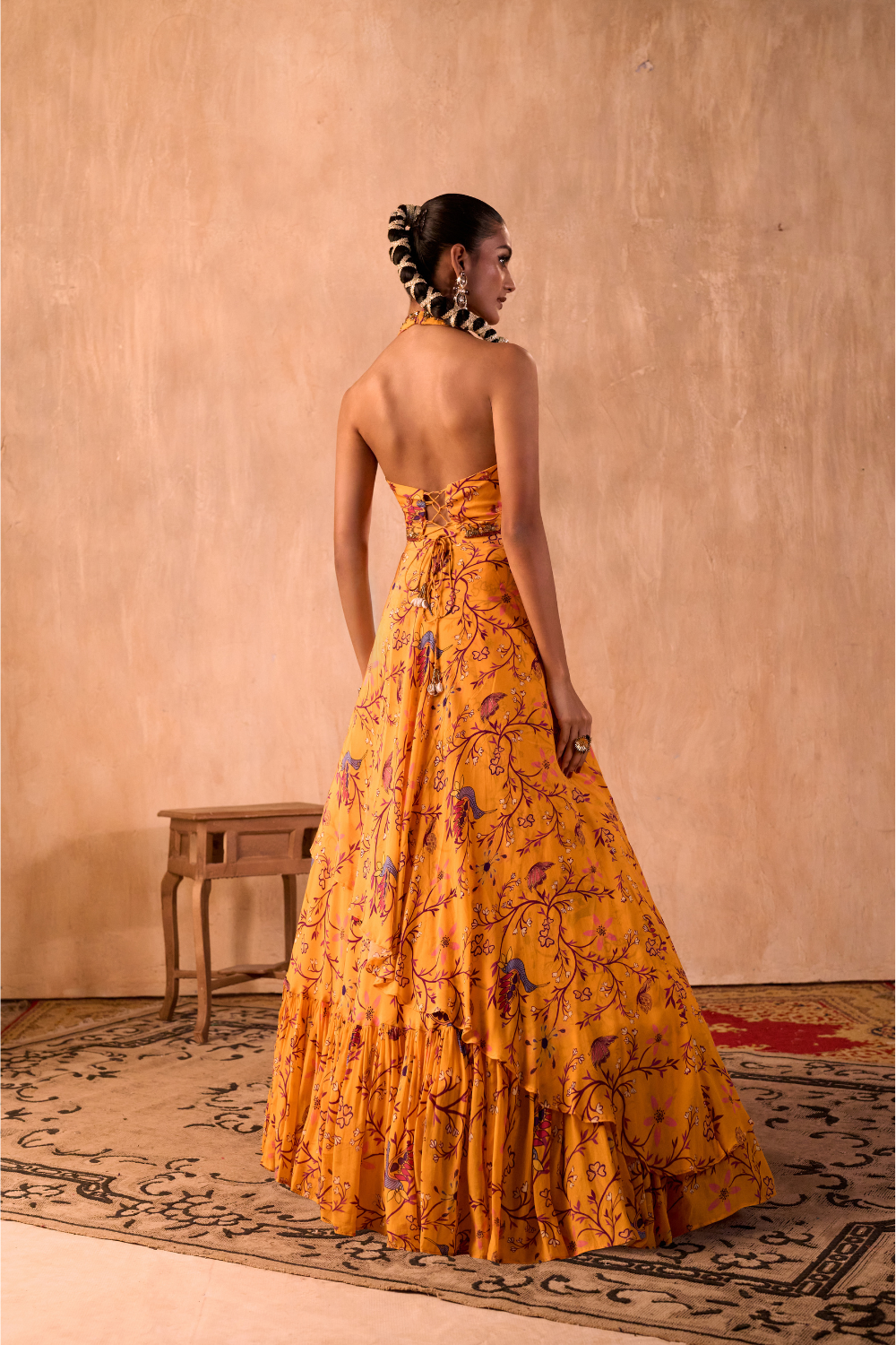 YELLOW PRINT EMBROIDERED HALTER CHOLI AND LAYERED LEHENGA SKIRT SET