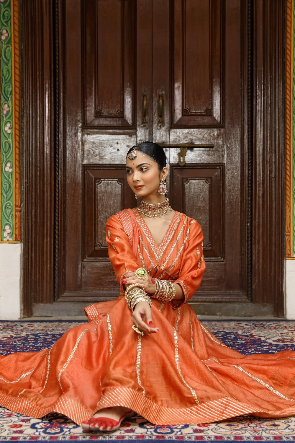 Rust Anarkali Set with Pittan, Gota, and Tassel Detailing