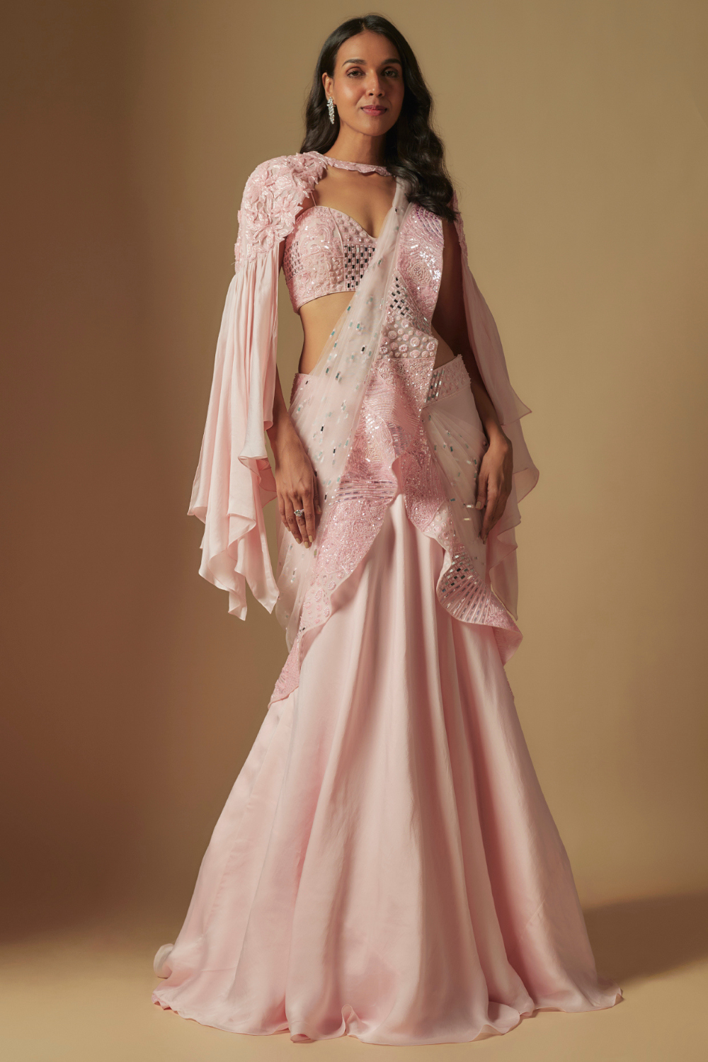 Zenith Hand embroidered blouse paired with drape saree and embroidered cape