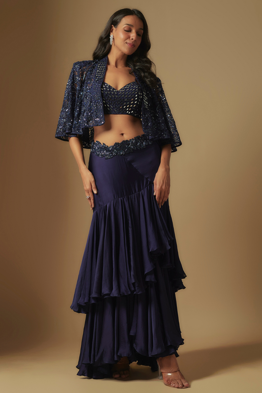 Marasu Mirror work blouse paired with hand embroidered cape and ruffled skirt