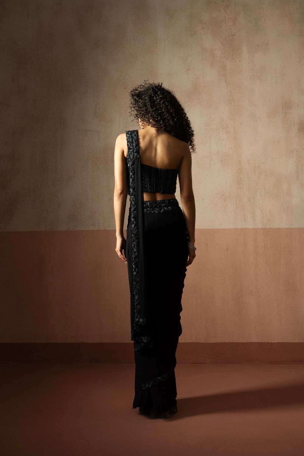 Predraped , black hand embroidered georgette saree