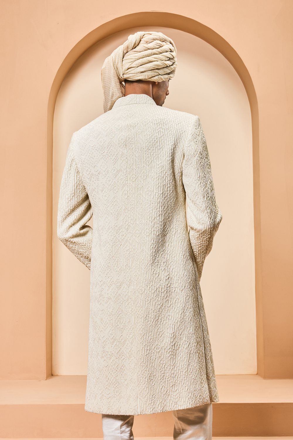 Ivory sherwani detailing with pearl,cutdana and pintex work