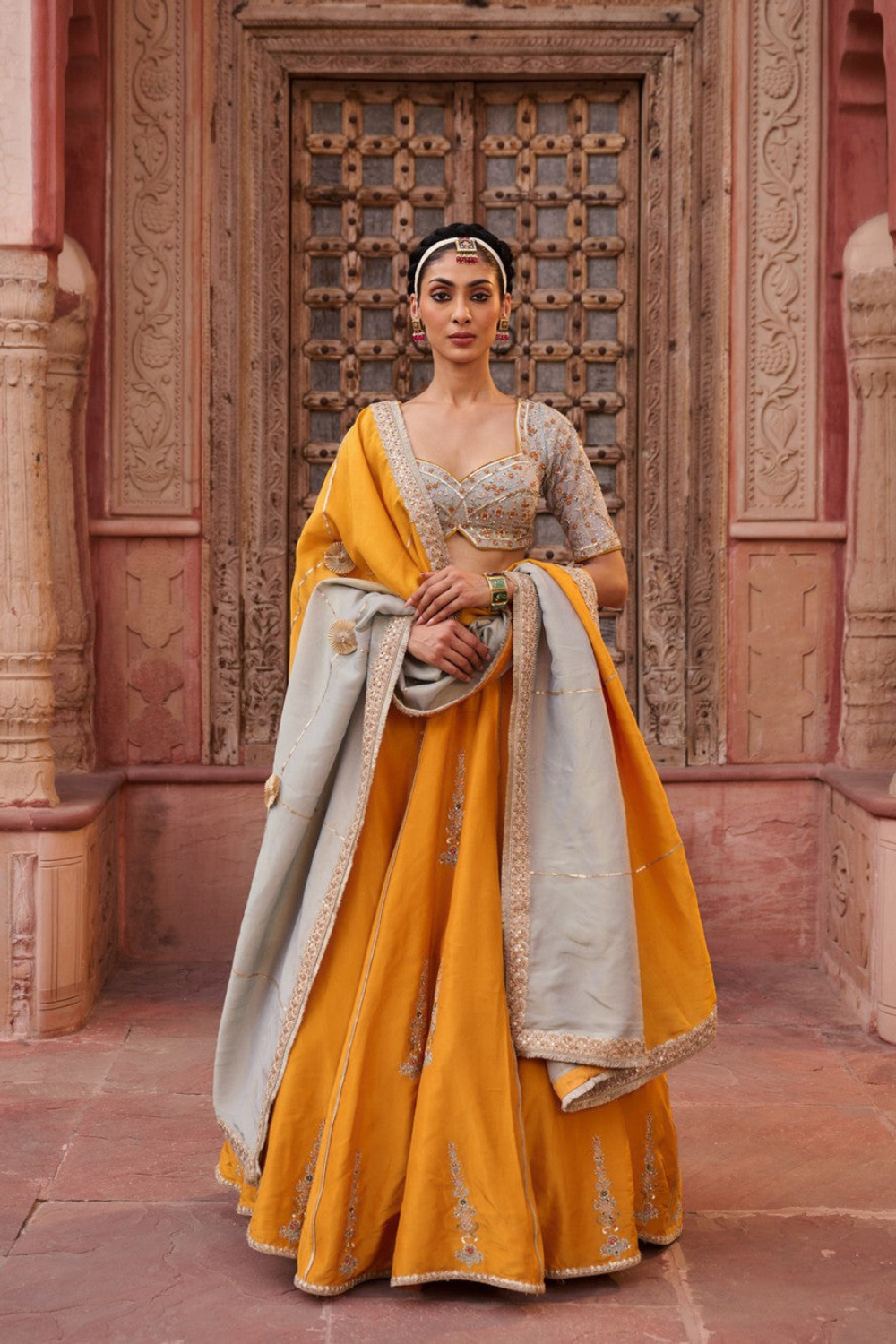 Mustard and Powder blue embroidered blouse, lehenga and dupatta