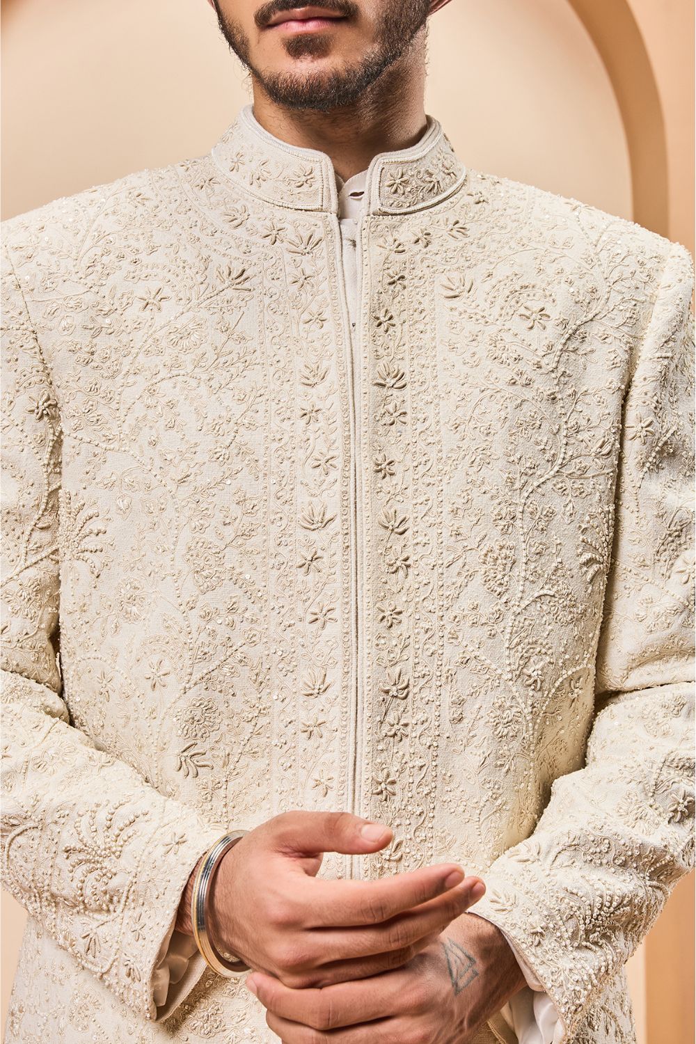 Ivory sherwani detailing with pearl,sequins and thread work