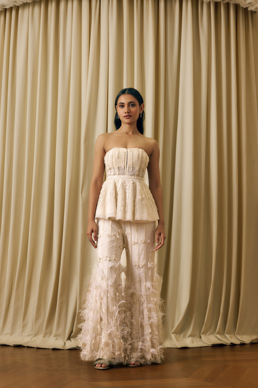 Peplum corset with 3d elements and feathers sharara