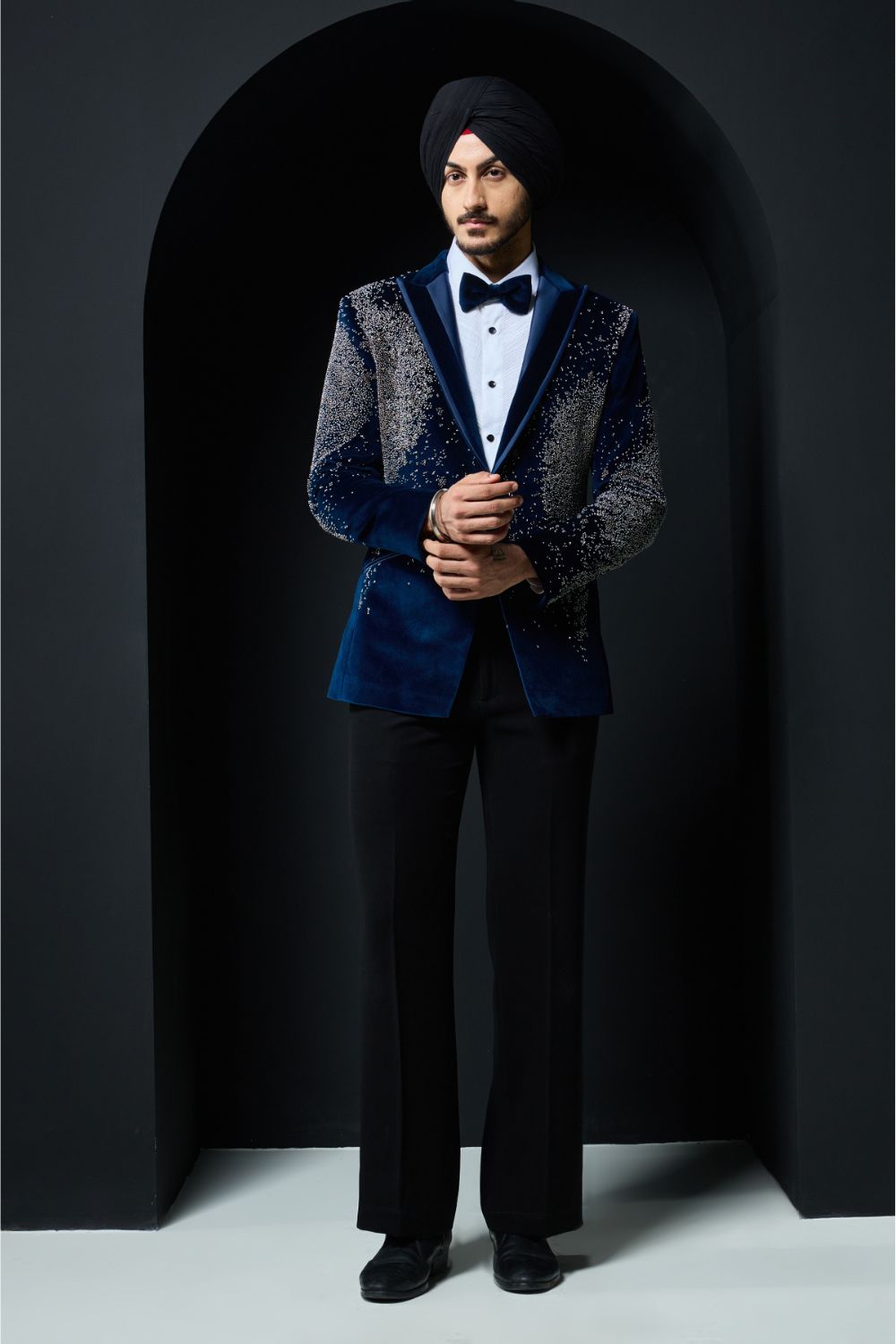 Teal blue tuxedo highlighted with sequins, pearls and cutdana