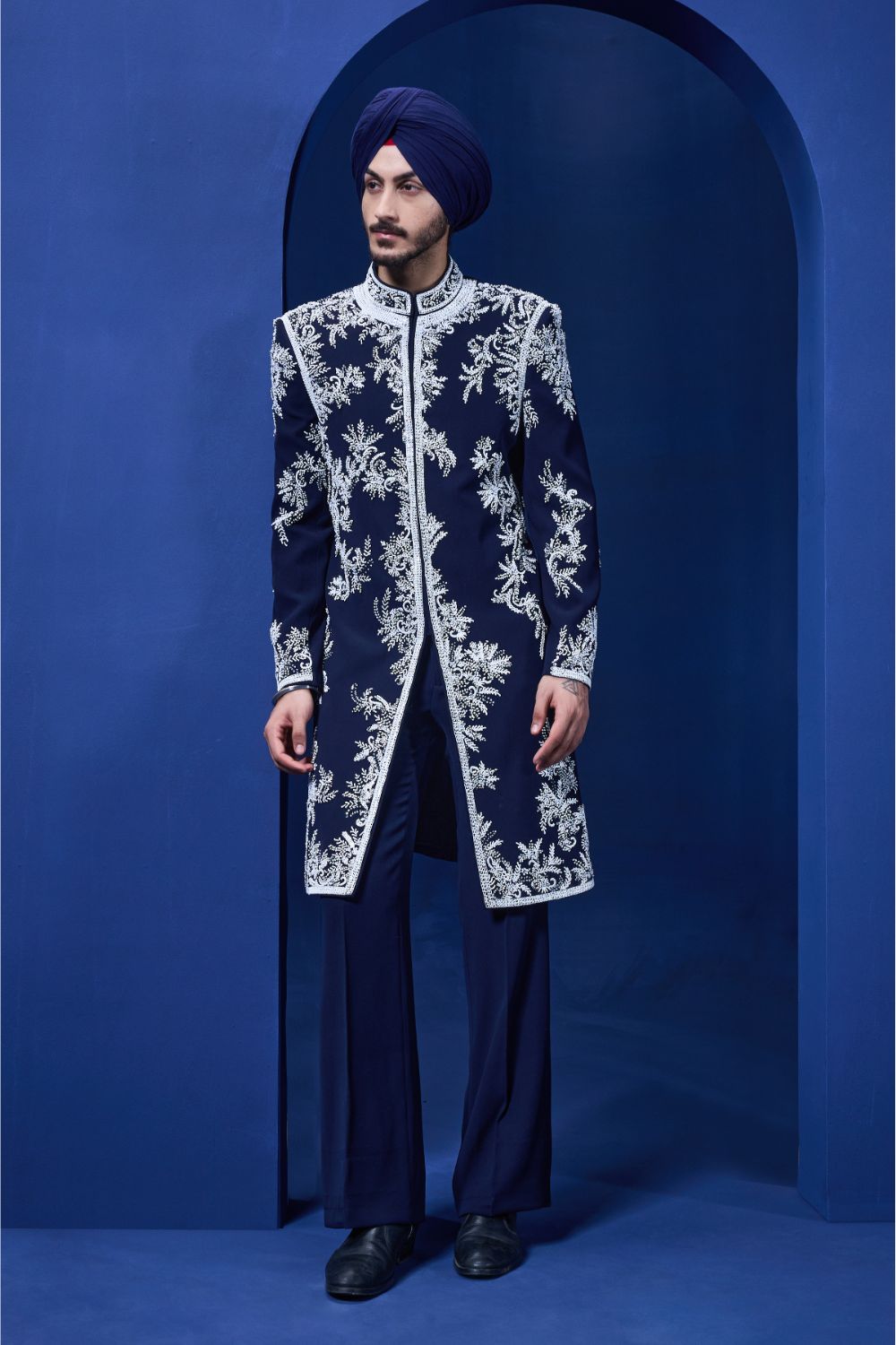 Navy blue Indo Western highlighted with sequins, pearls, cutdana and spring thread work