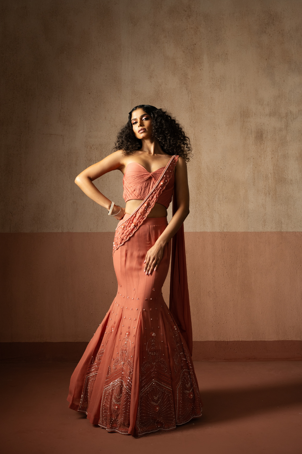 Fishtail style , peach coloured, hand embroidered georgette fishtail saree