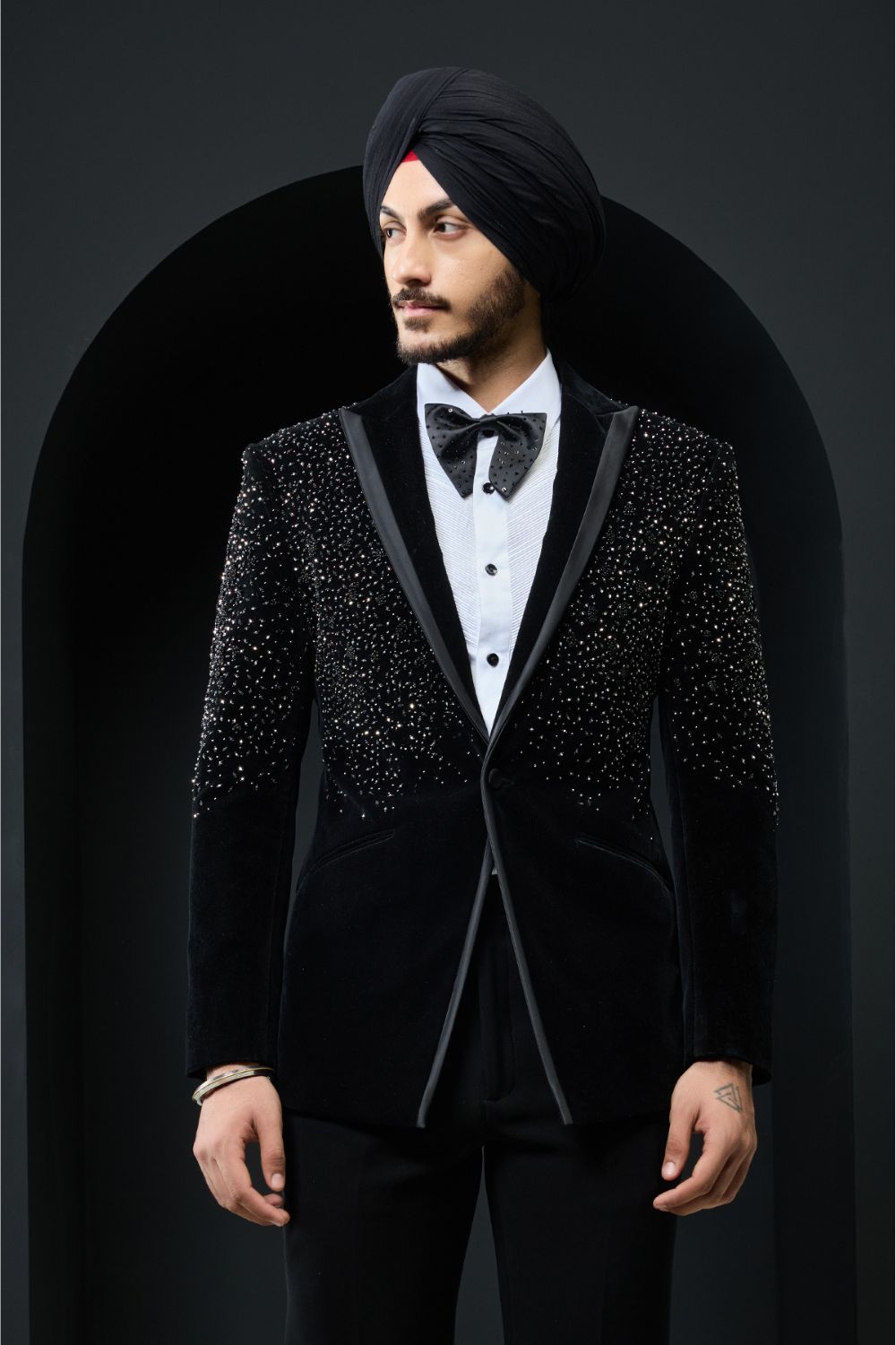 Black tuxedo highlighted with pearls and crystal