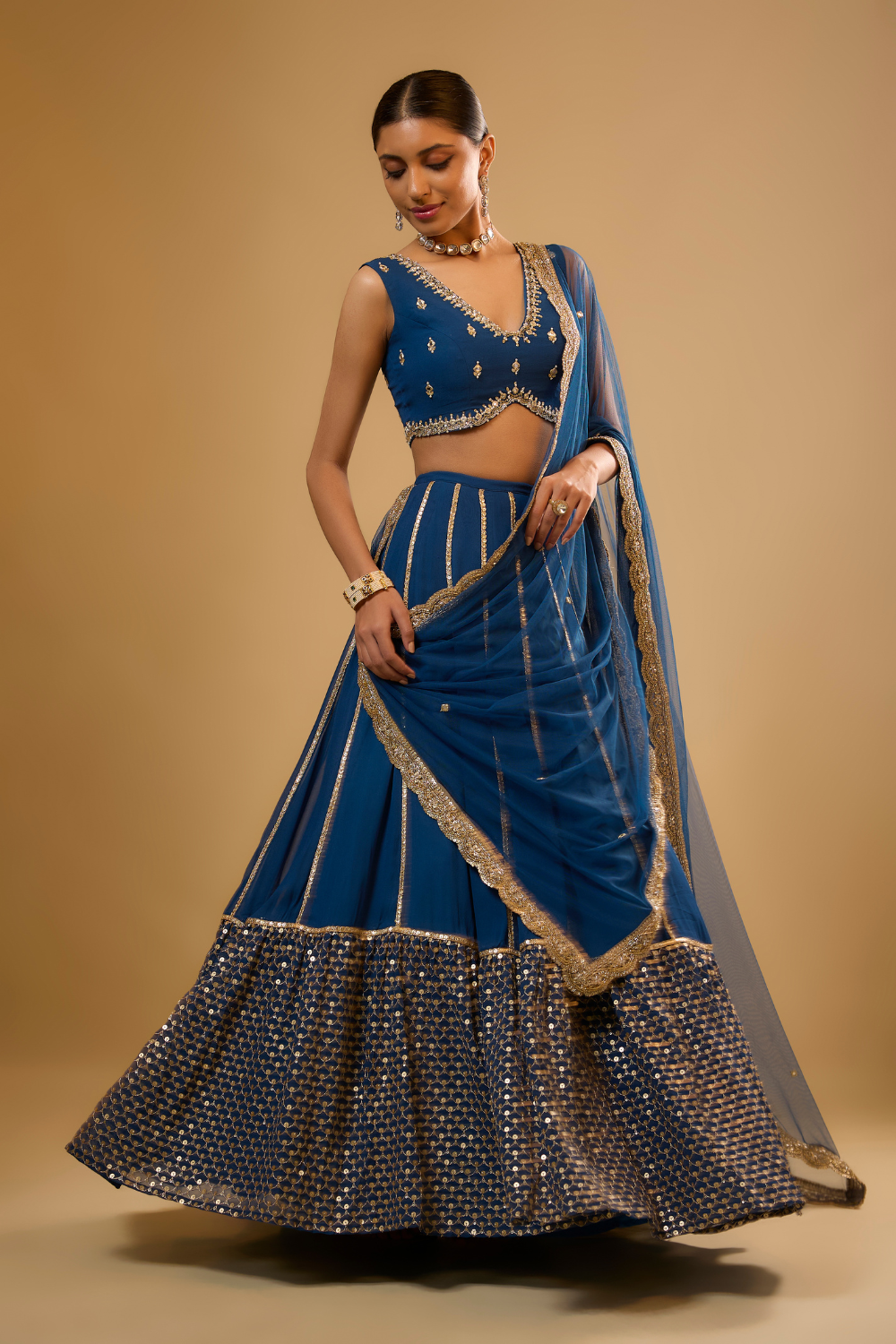 Egyptian blue georgette lehenga set embroidered with mirrors and gold sequins