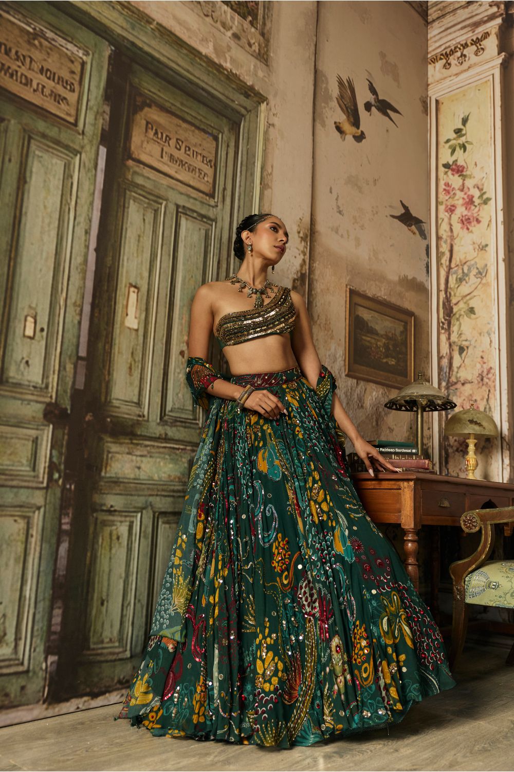 DARK GREEN EMBELLISHED BOUSE WITH PRINTED AND HIGHLIGHTED LEHENGA SET