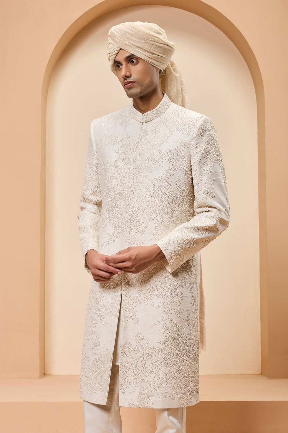 Ivory sherwani detailing with pearl,cutdana and thread work