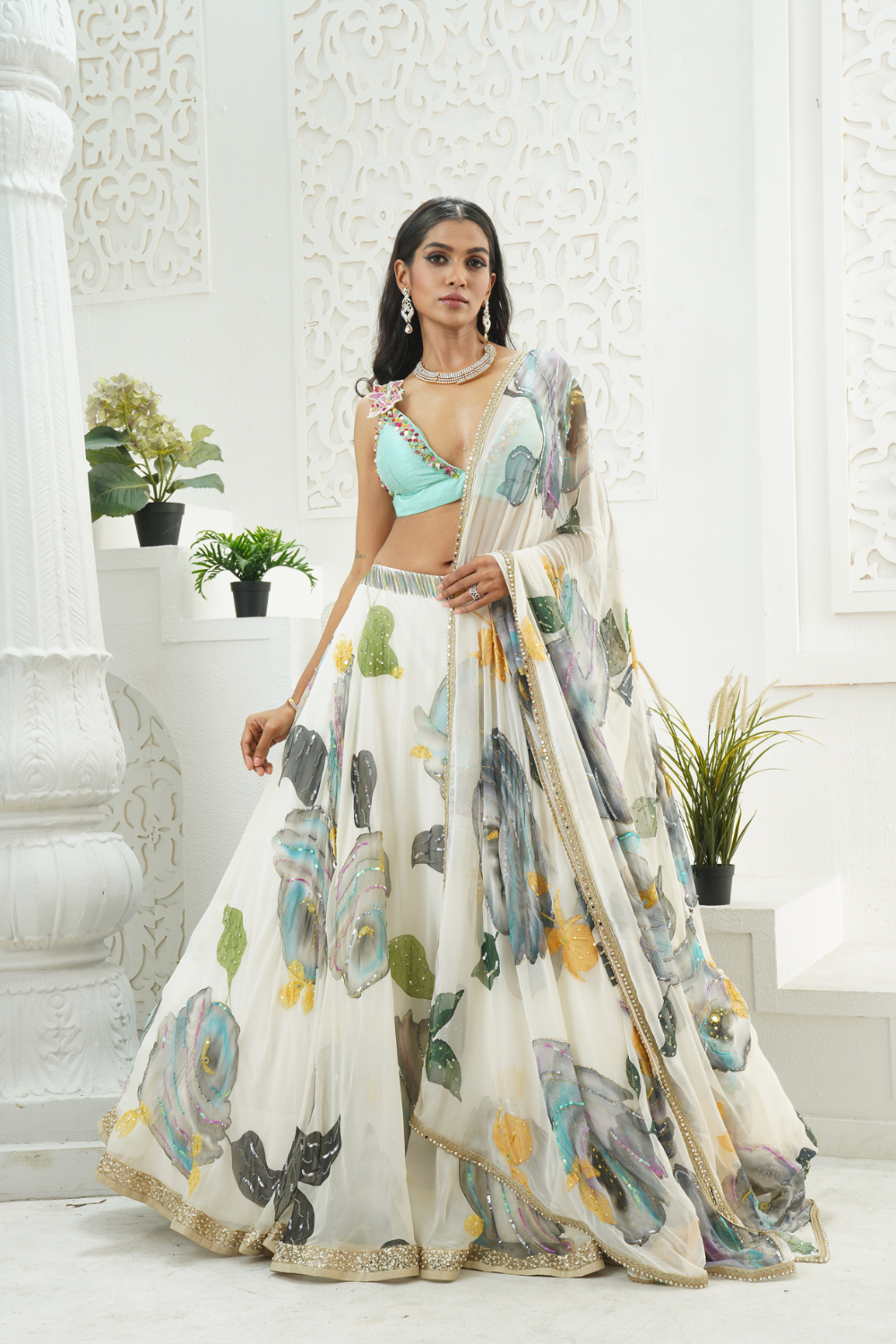 Ivory hand painted lehenga and Mint bralette blouse set