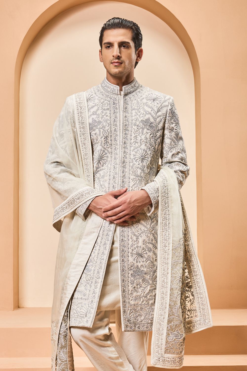 Ivory sherwani detailing with silver zari,pearl,sequins and thread work
