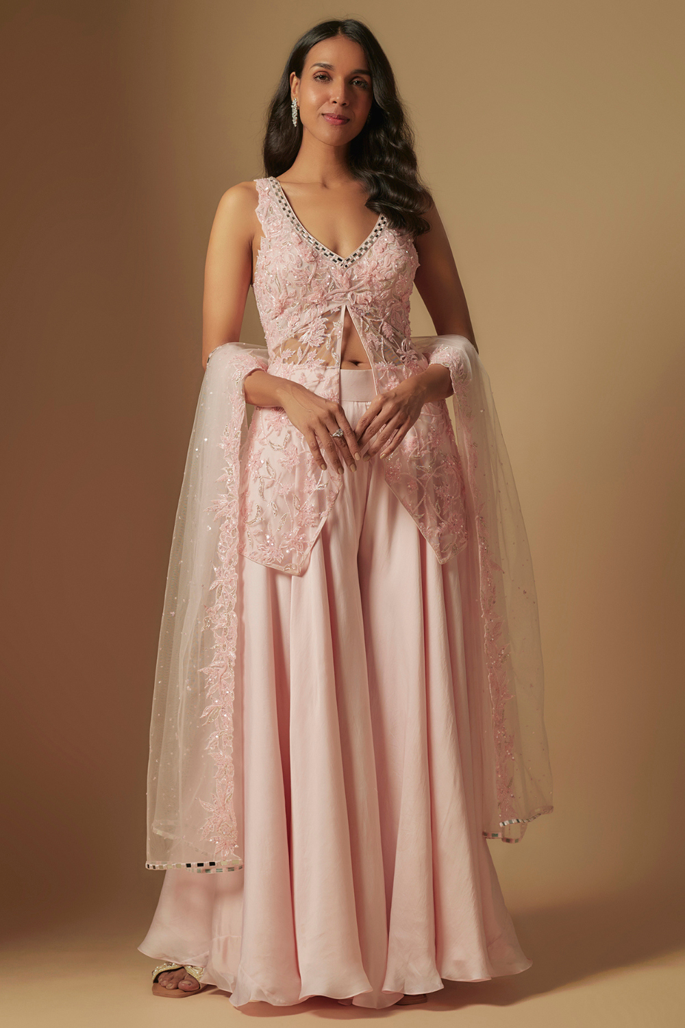 Noom Hand  embroidered  short kurti  paired  with sharara and dupatta