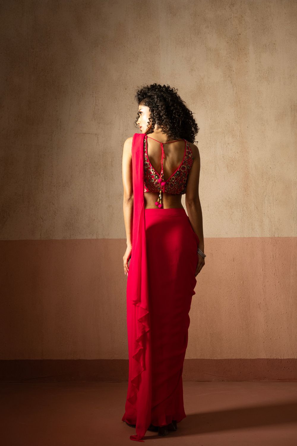 Predraped , fuschia pink , embroidered georgette saree with corset blouse