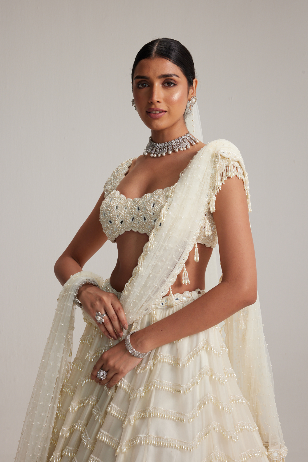 Off White Mirror and Pearl Drop Bridal lehenga set with Veil