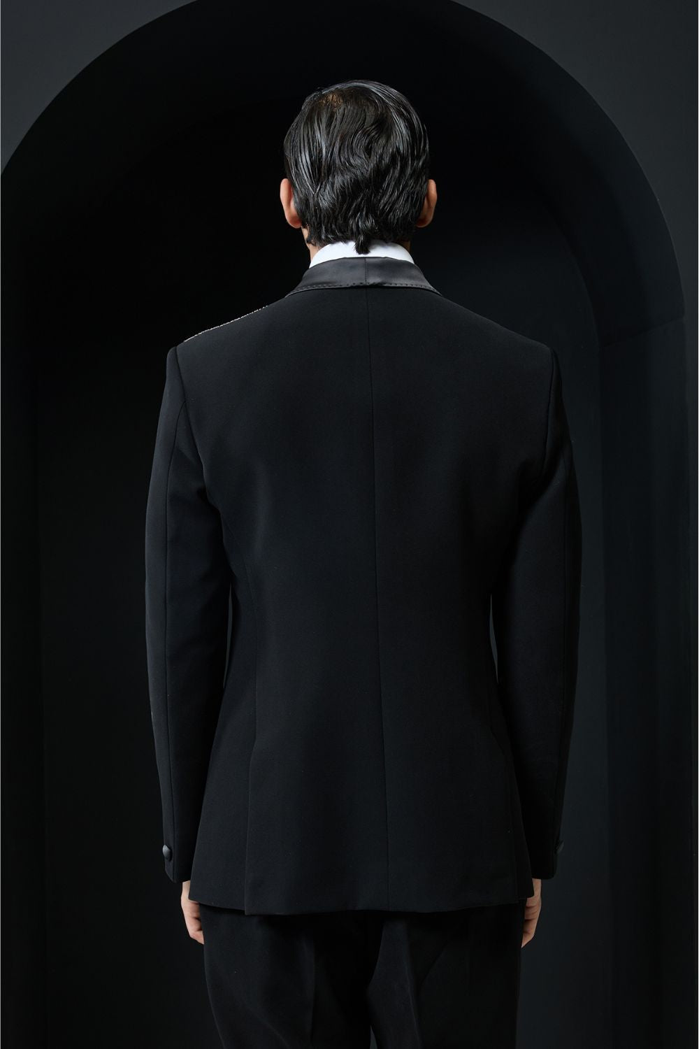 Black tuxedo highlighted with silver zari , cutdana and peals