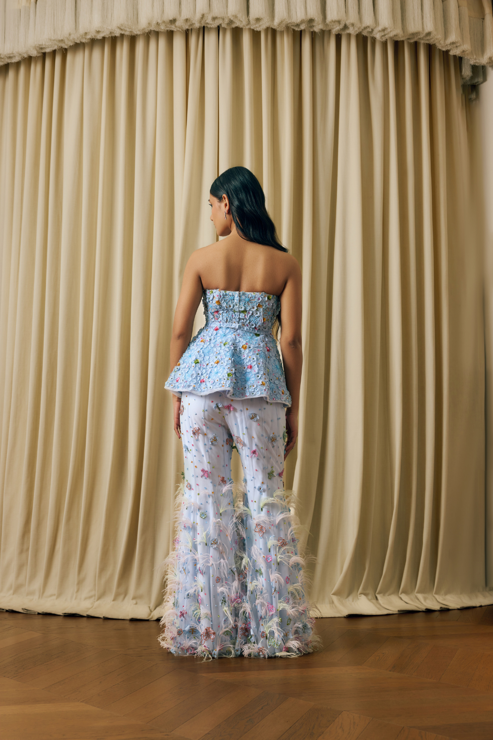 Peplum corset with 3d elements and feathers sharara