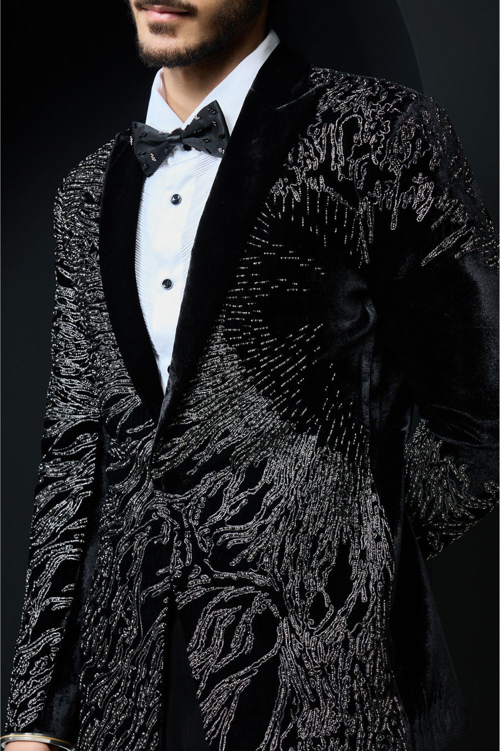 Black tuxedo highlighted with silver zari  and peals