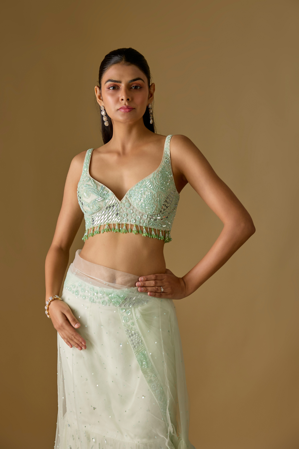 Aquaria- Mint designer pre draped saree in satin organza base with hand embroidery. It is paired with a tulle blouse.