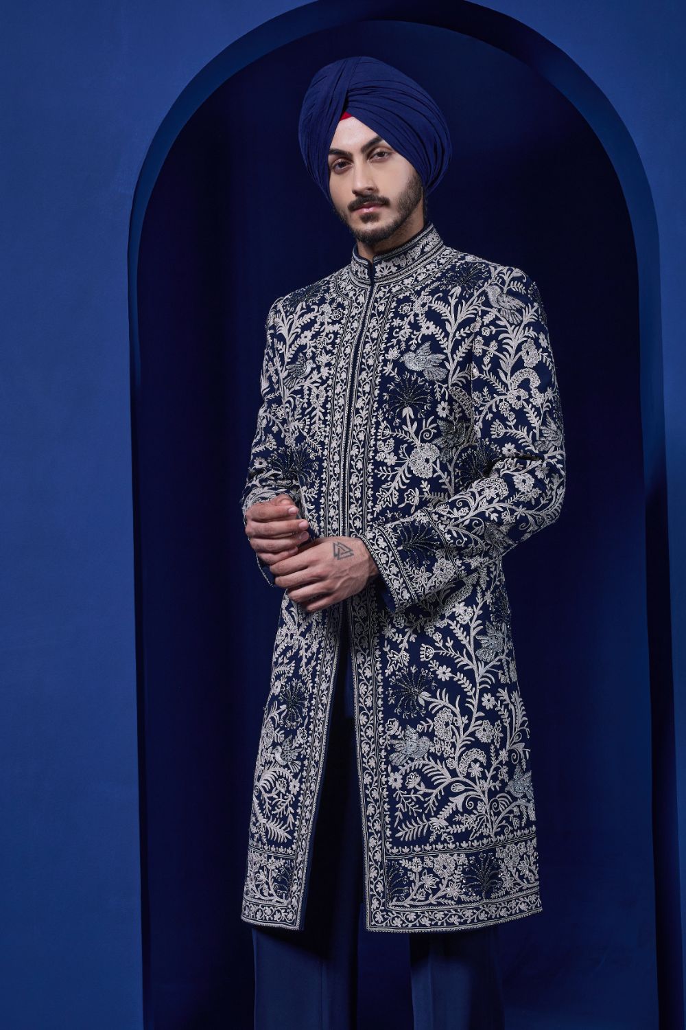 Navy blue Indo Western highlighted with sequins, pearls and thread work