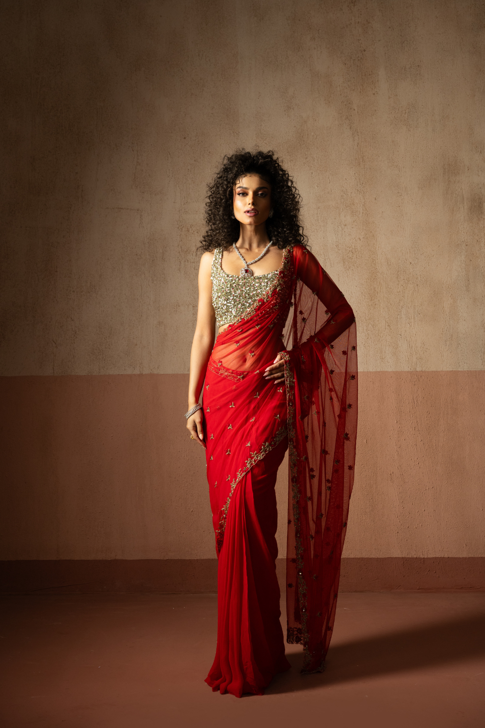 Predraped , red , hand embroidered net & georgette saree with golden blouse