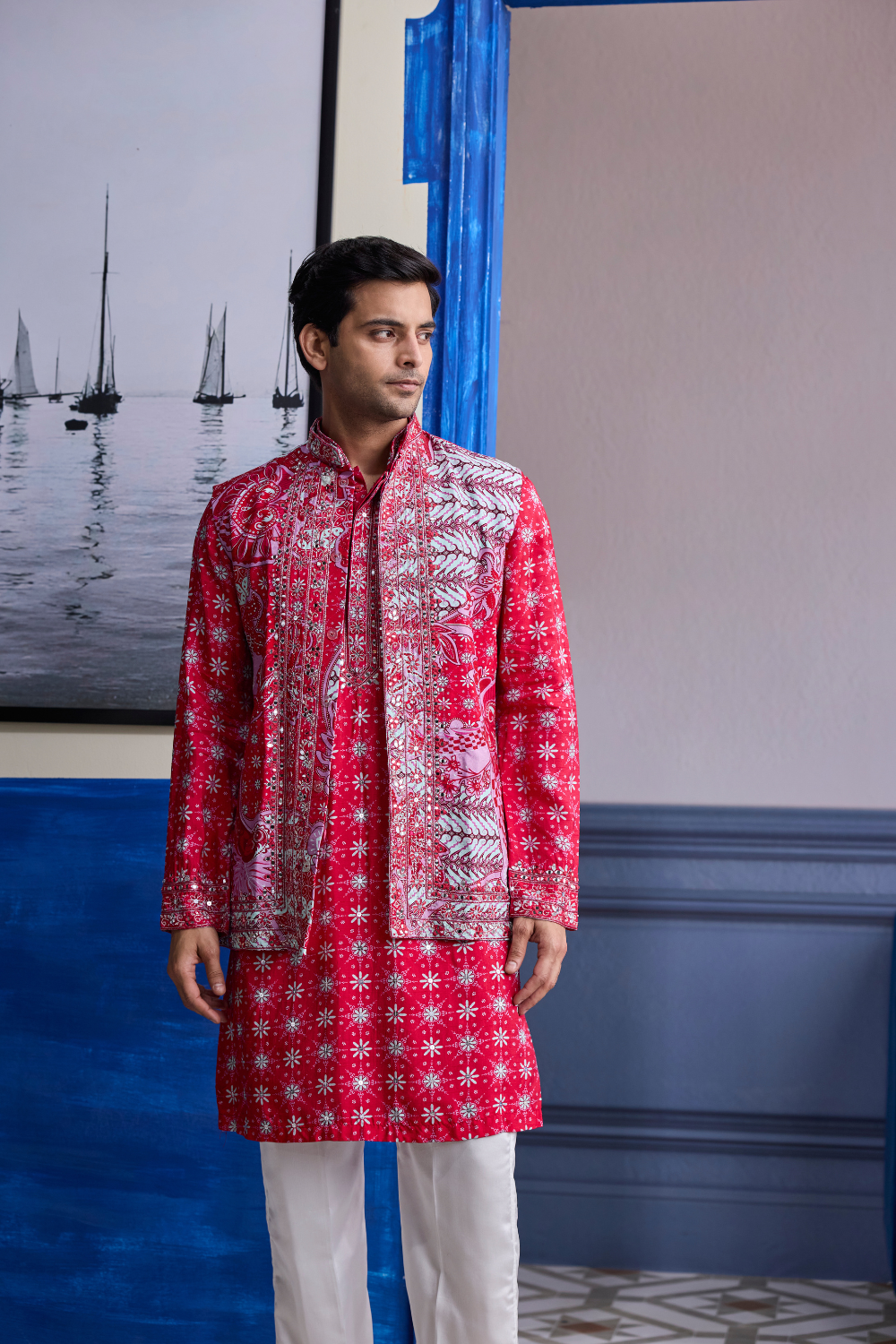RED PRINT HIGHLIGHTED  KURTA WITH PRINT EMBROIDERED BUNDI AND IVORY PANTS