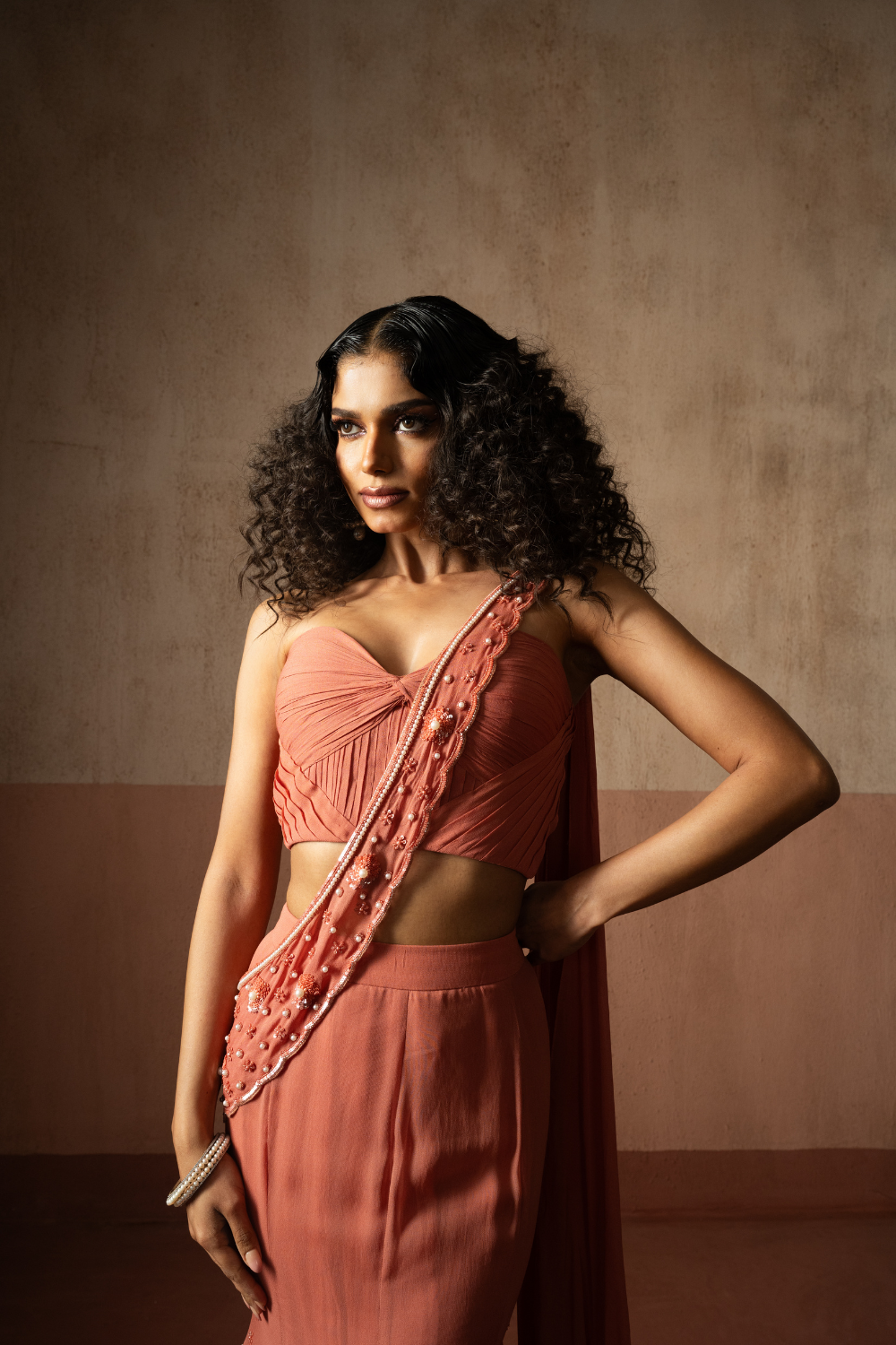 Fishtail style , peach coloured, hand embroidered georgette fishtail saree