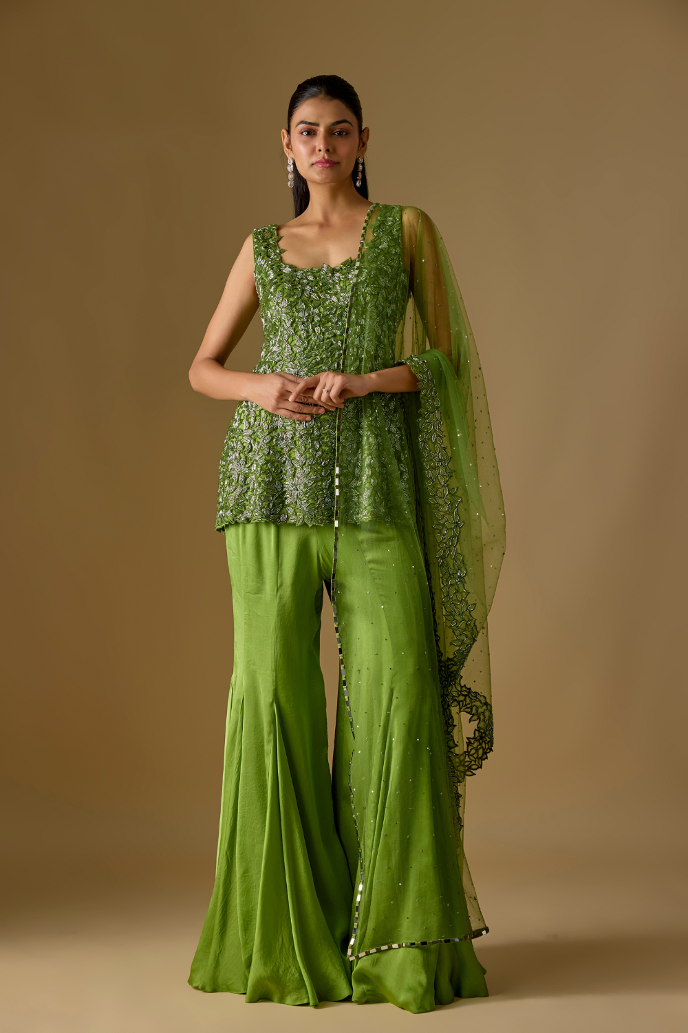 Driftlyn- Olive Green hand-embroidered short kurti paired with sharara and matching dupatta in satin organza and tulle fabric.