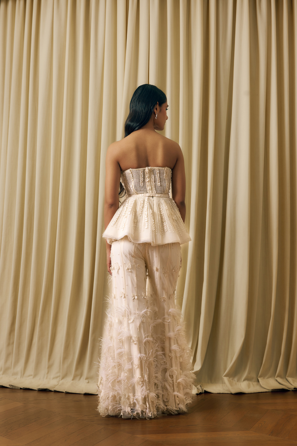 Peplum corset with 3d elements and feathers sharara