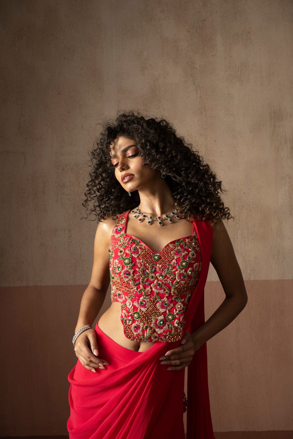 Predraped , fuschia pink , embroidered georgette saree with corset blouse